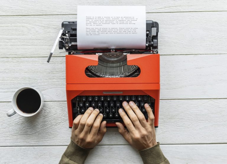 Aerial view of typing on a retro typewriter image from rawpixel